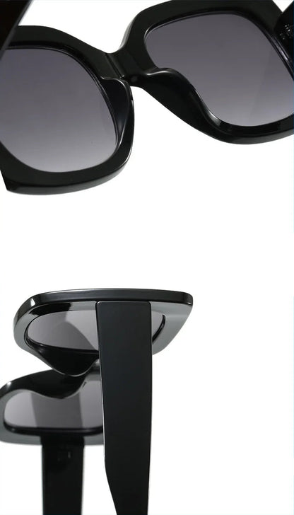 Close-up product views of black oversized sunglasses with dark tinted lenses, shown on a white background with blue border lines.