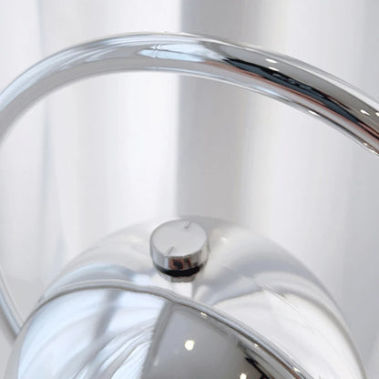 Close-up of a shiny metallic clutch bag with reflective surface