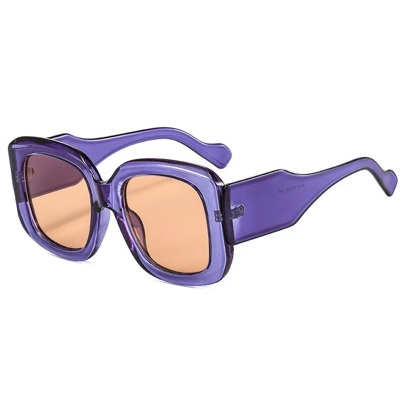 Purple sunglasses with a white background