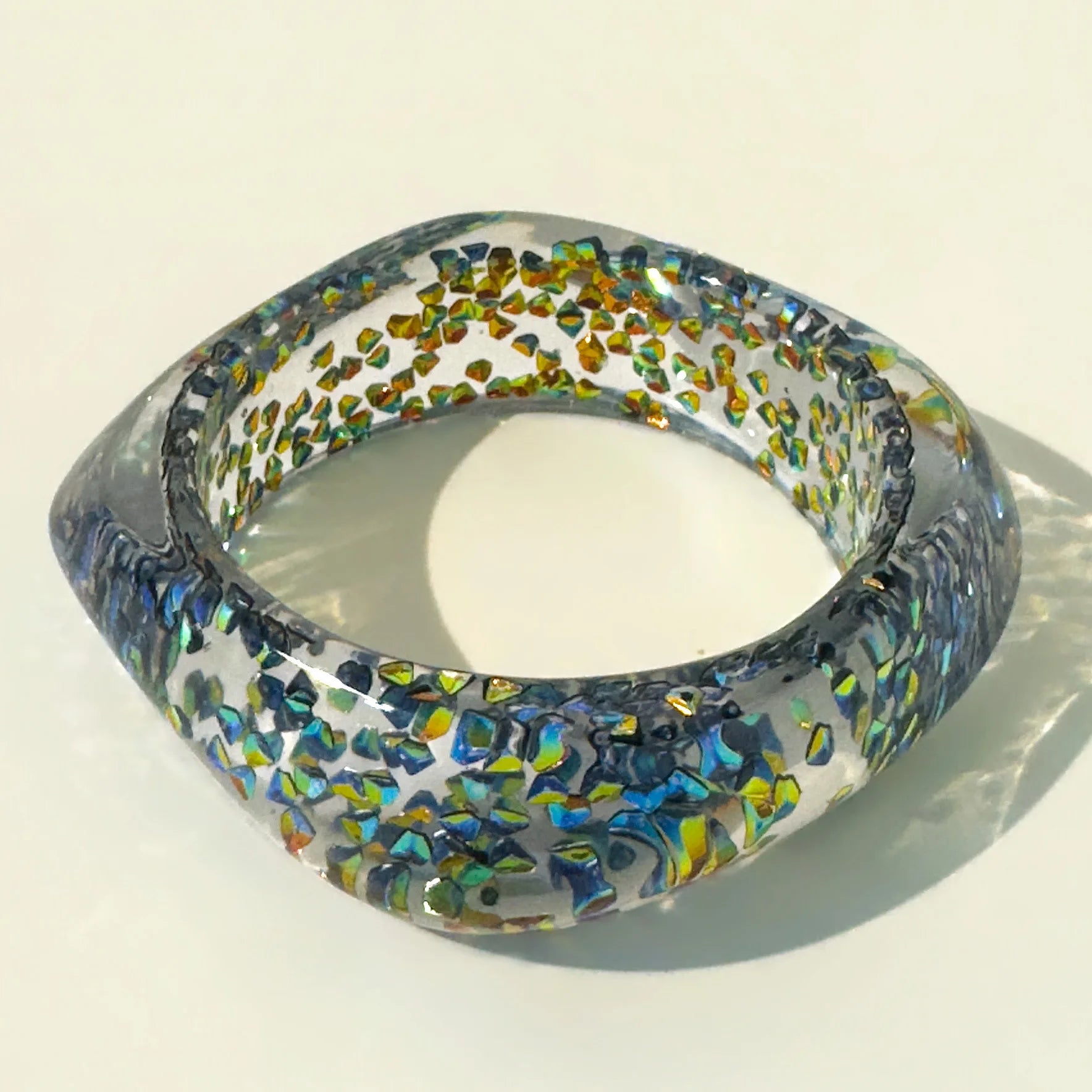 Multicoloured bangle on a beige background