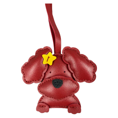 Red dog-shaped keychain with a yellow star on a white background