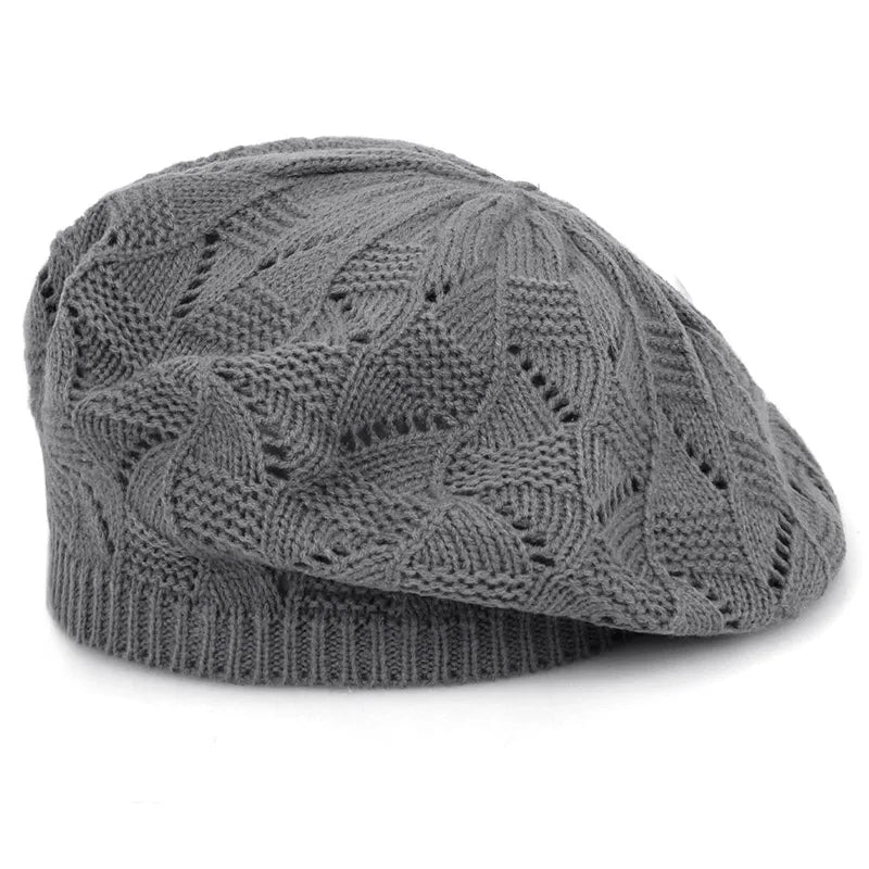 Grey knit beanie on a white background