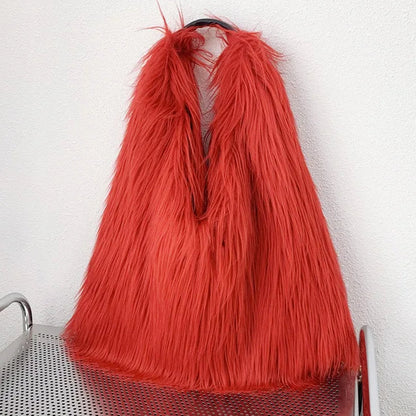 Red fluffy bag on a metal trolley against a white wall