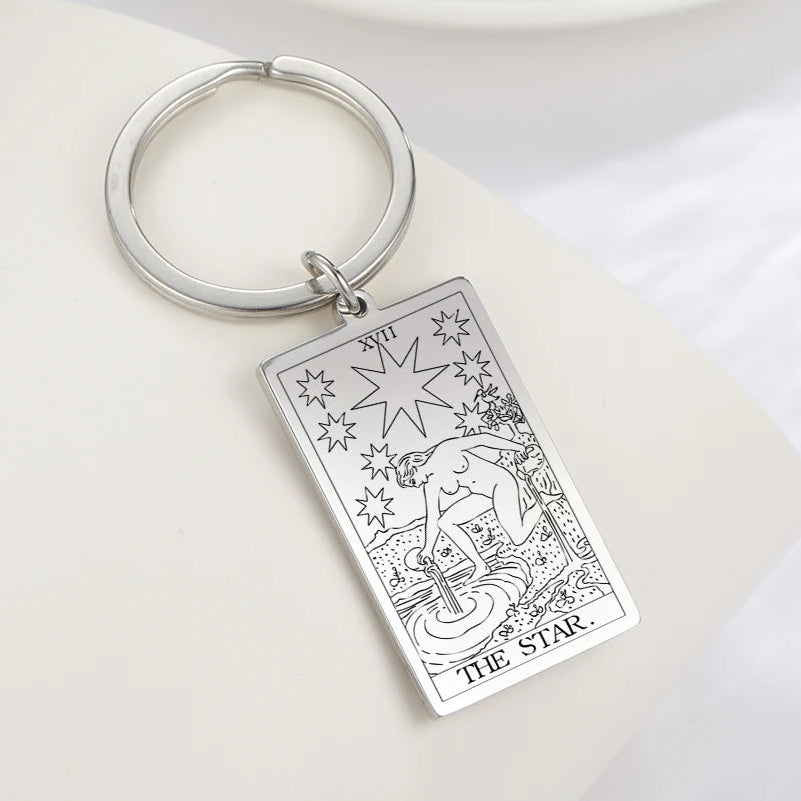 Keychain with 'The Star' tarot card design on a white background