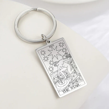 Keychain with 'The Star' tarot card design on a white background