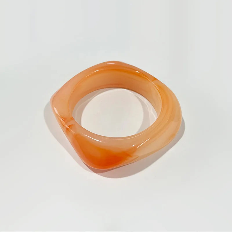 Orange bangle on a white background