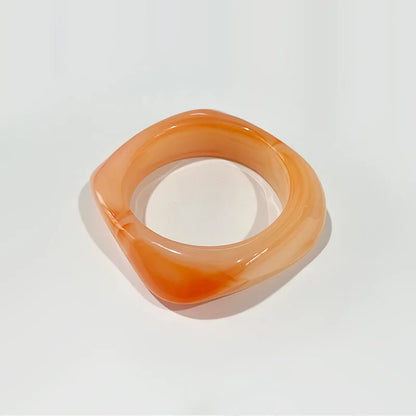 Orange bangle on a white background