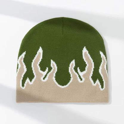 Knitted beanie with green flame pattern on a white background
