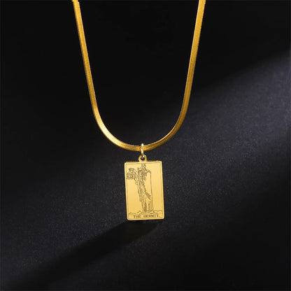Gold necklace with a rectangular pendant on a black background
