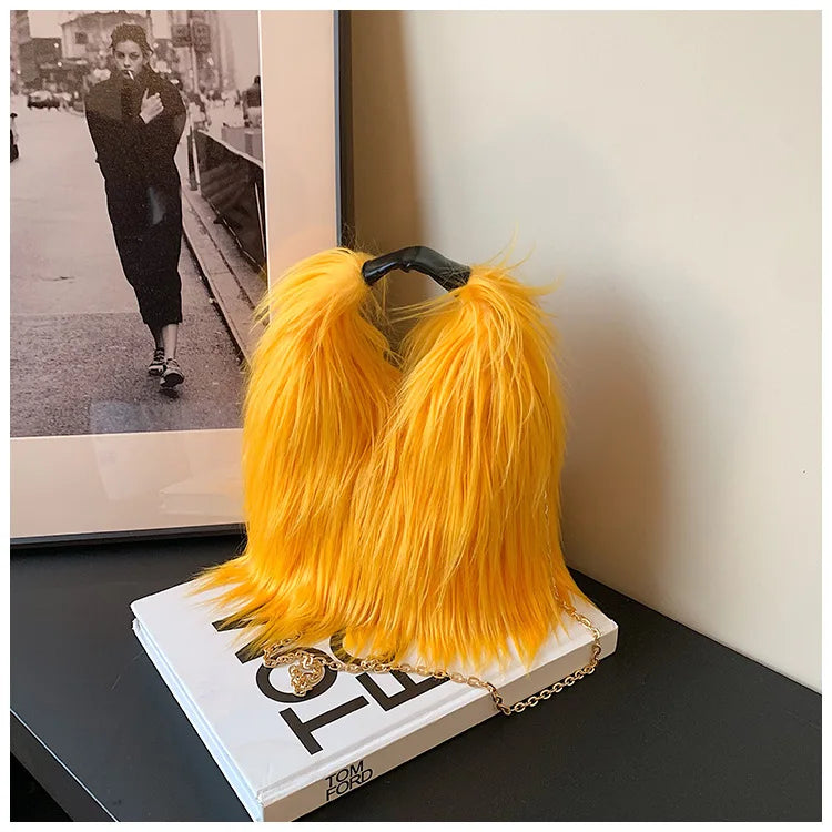 Yellow fluffy handbag on a book with a blurred background