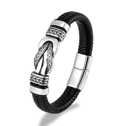 Black braided leather bracelet with silver metal clasp on a white background