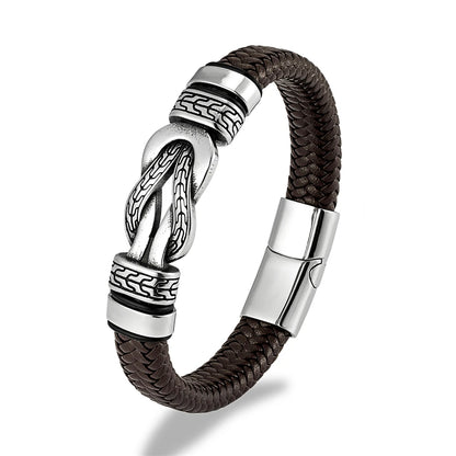 A men's braided leather bracelet with a polished silver-toned knot centerpiece and matching silver-toned accent beads, shown on a clean white background.