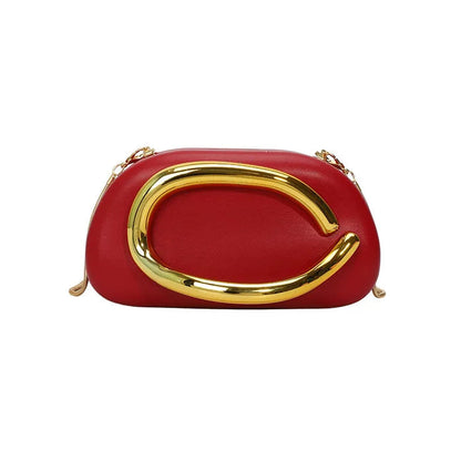 Red handbag with gold handle on a white background