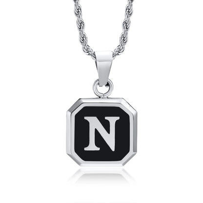 Necklace with a black and silver pendant featuring the letter 'N' on a white background