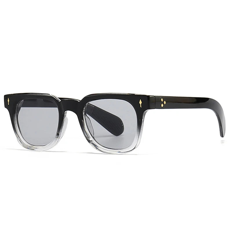 Black sunglasses with gold accents on a white background