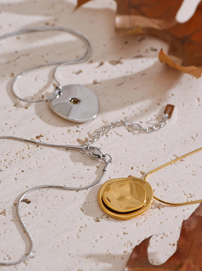 Jewellery set with necklaces on a textured surface