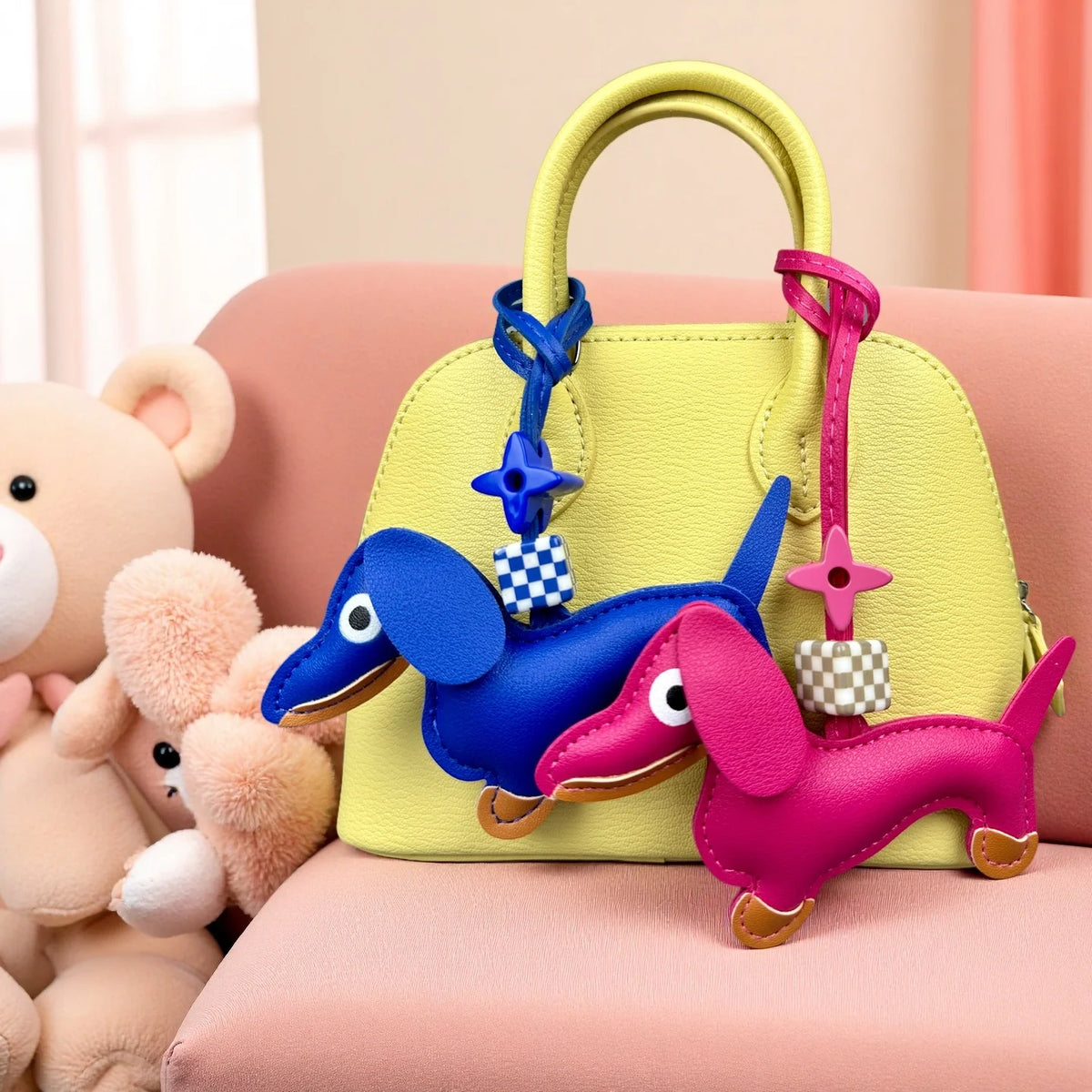 Yellow handbag with colourful dachshund-shaped keychains on a pink surface with plush toys.