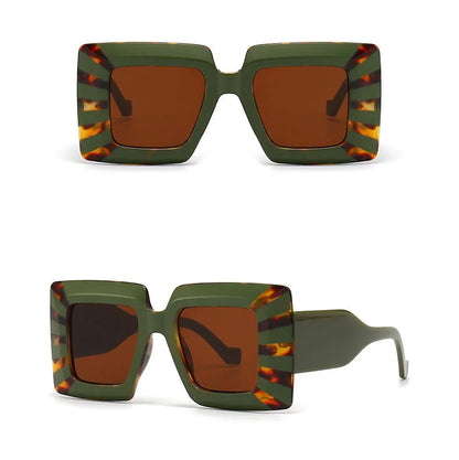 Green and brown sunglasses with tortoiseshell accents on a white background