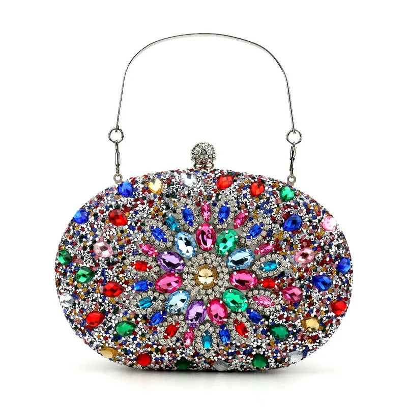 An oval-shaped evening clutch bag with a hasp closure, decorated with a colourful acrylic crystal pattern.