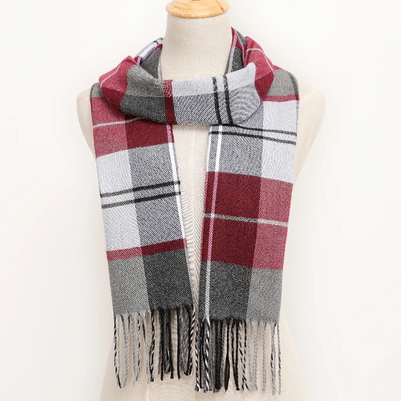 Plaid scarf with fringes on a mannequin against a white background