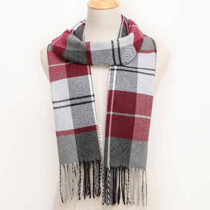 Plaid scarf with fringes on a mannequin against a white background