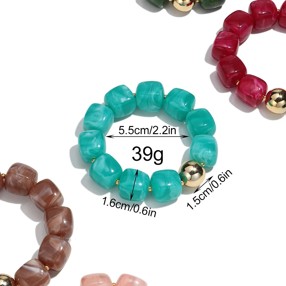 Close-up of colourful beaded bracelets with measurements and weight displayed.