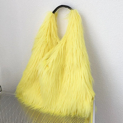 Yellow fur bag on a metal trolley against a white wall