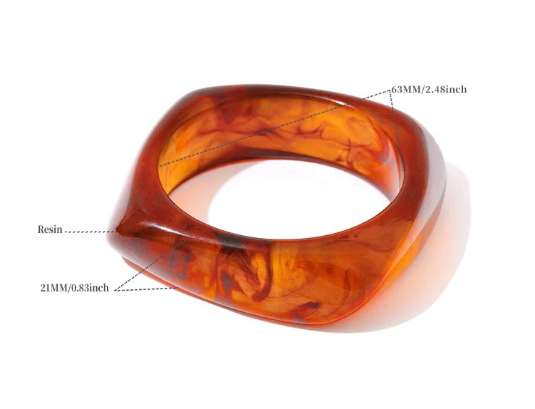 Brown resin bangle with measurements and material details on a white background