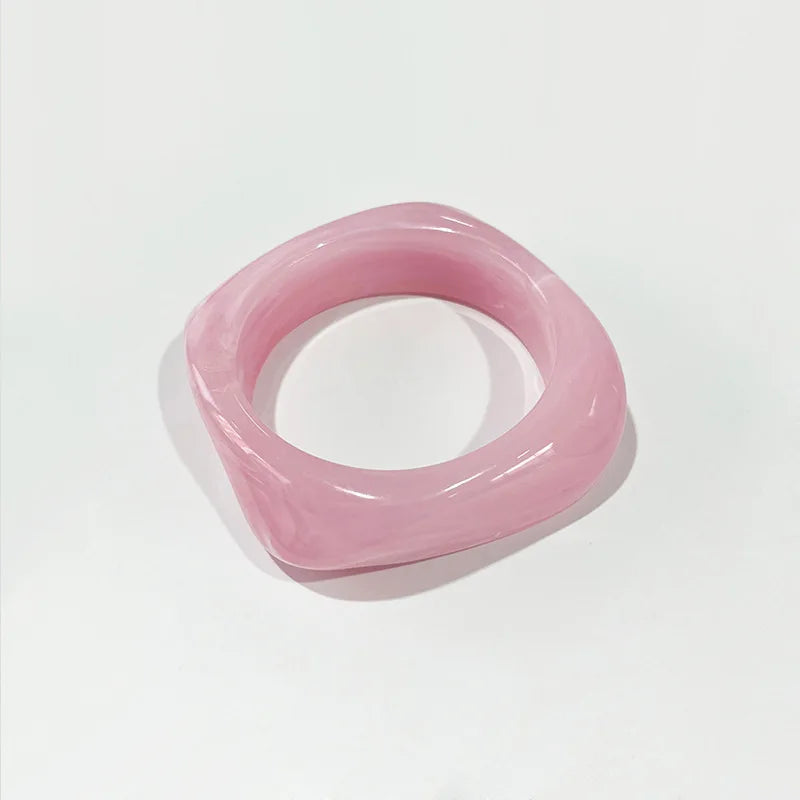 Pink bangle on a light grey background