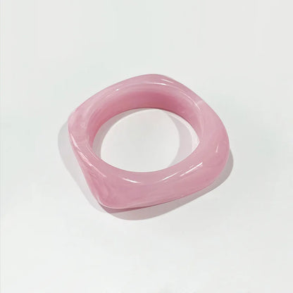 Pink bangle on a light grey background
