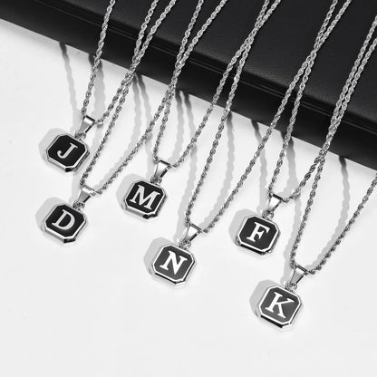 Set of necklaces with letter pendants on a white background