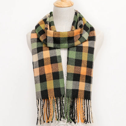 Plaid scarf with fringes on a mannequin against a white background