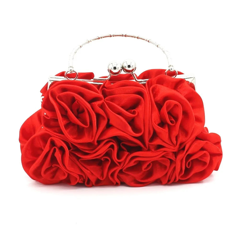 Red rose-shaped clutch bag on a white background