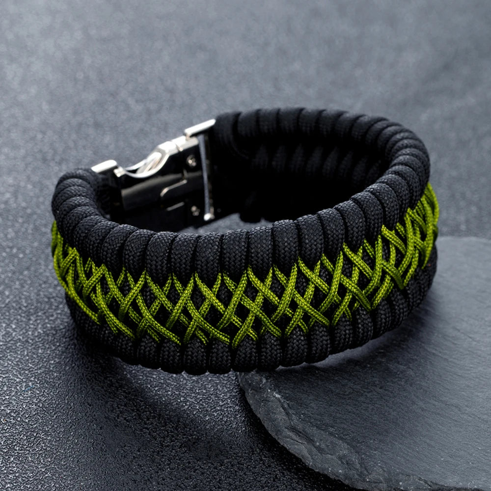 Black and green braided bracelet on a dark grey background