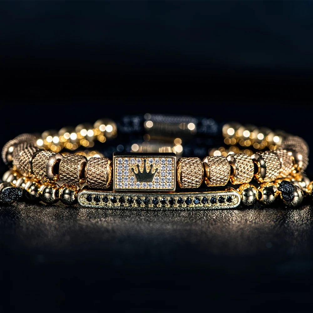 Gold bracelet with diamond accents on a dark background