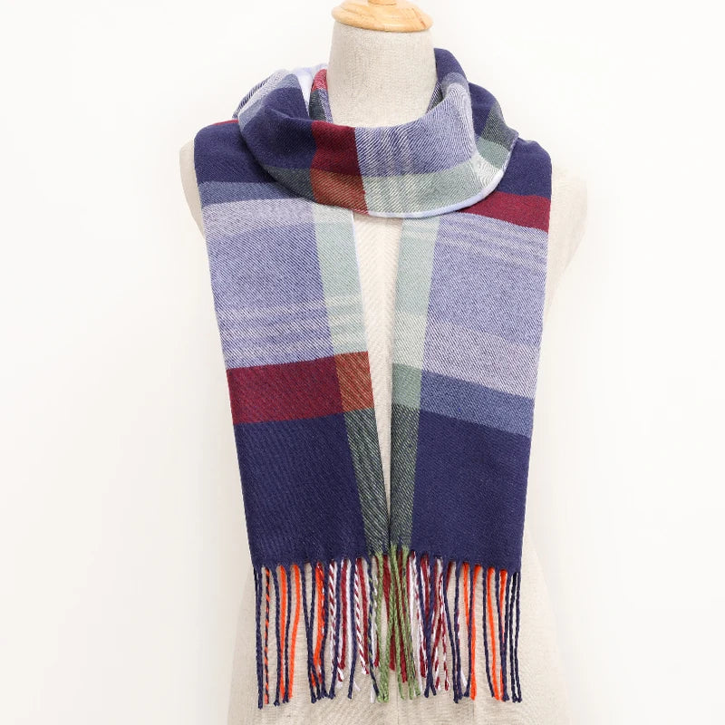 Plaid scarf with colorful fringes on a mannequin against a white background