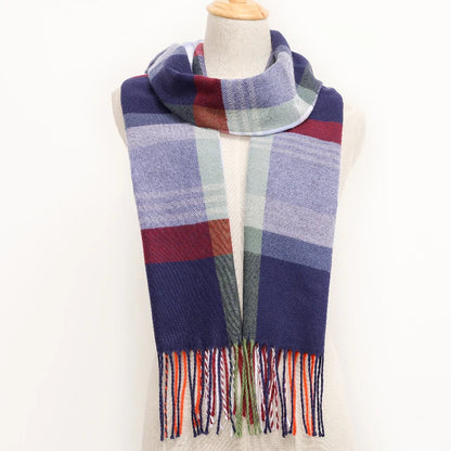 Plaid scarf with colorful fringes on a mannequin against a white background
