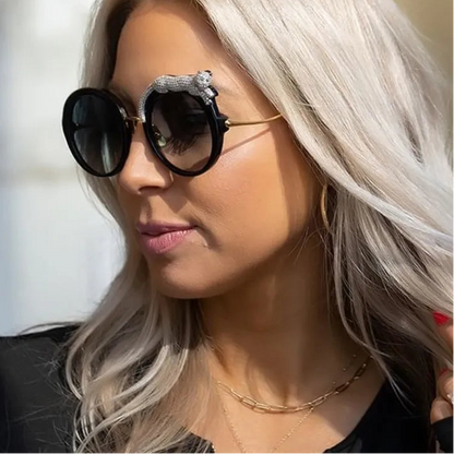 Woman wearing sunglasses with decorative elements