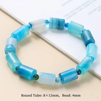 Lake Blue Striped Agate bracelet on a light beige surface.