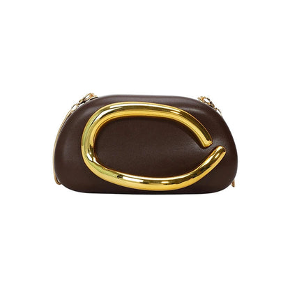 Brown clutch with gold handle on a white background