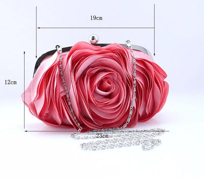 Pink rose-shaped handbag with chain strap and measurements on a white background
