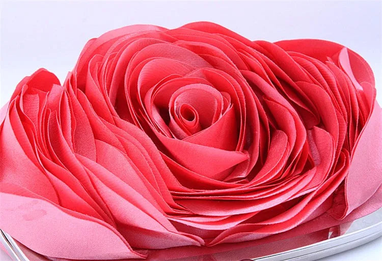 Close-up of a pink rose clutch on a white background